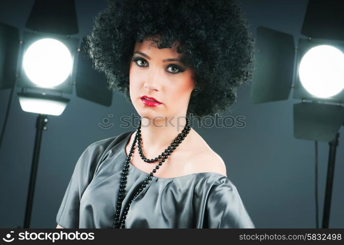 Young attractive girl with afro curly haircut