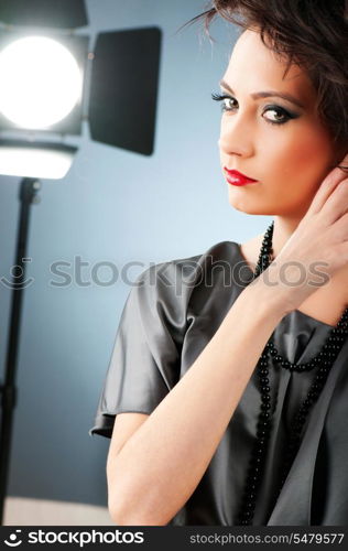 Young attractive girl with in the studio shooting