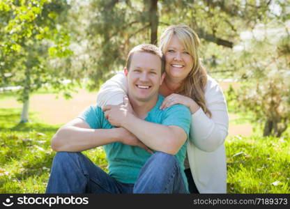 Young Attractive Loving Couple Hugging in the Park.