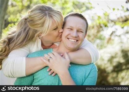 Young Attractive Loving Couple Hugging in the Park.