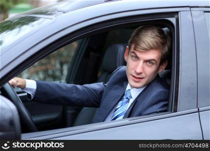 young attractive man young man in the car