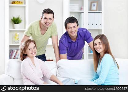 Young attractive people in the apartment