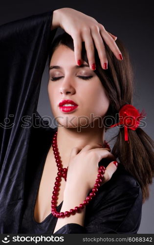 Young attractive woman dancing flamenco