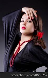 Young attractive woman dancing flamenco