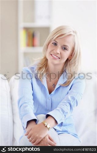 Young attractive woman in the apartment