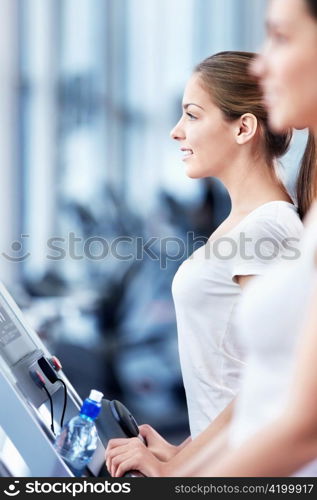 Young attractive woman in the fitness club