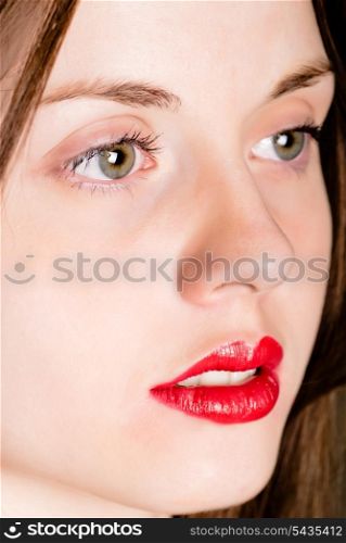 Young attractive woman&rsquo;s face close up red lips