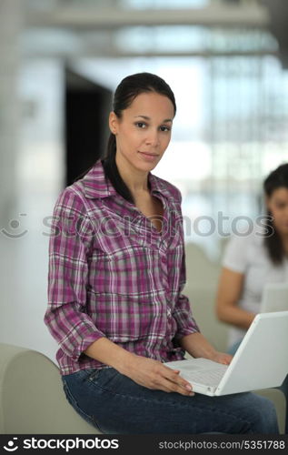Young attractive woman using a laptop computer