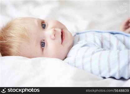 Young Baby Boy Lying In Bed