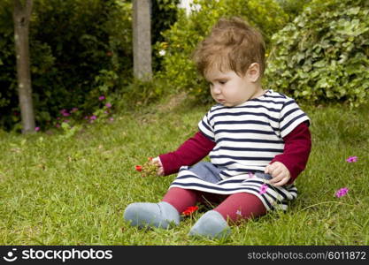 young baby girl at the garden