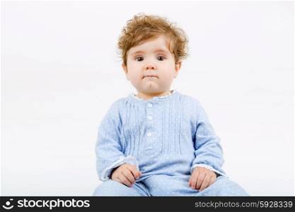 young baby portrait on a grey background
