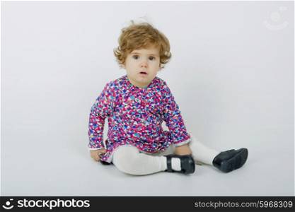 young baby portrait on a grey background