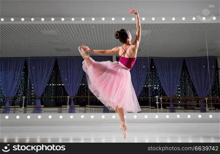 Young ballerina in training hall