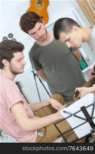 young band music playing a song in a recording studio