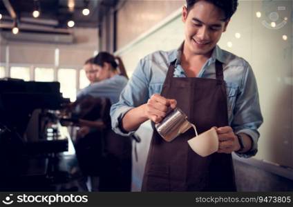 Young barista adept in champion coffee brewing, creating latte art in a cup of coffee for a customer.