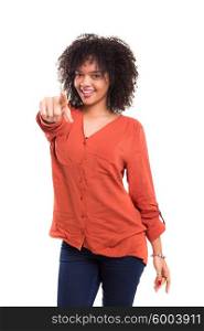 Young beautiful african woman pointing at you, isolated over white