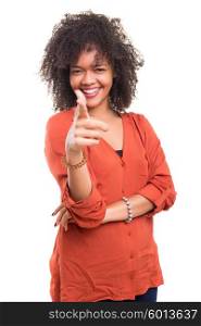 Young beautiful african woman pointing at you, isolated over white