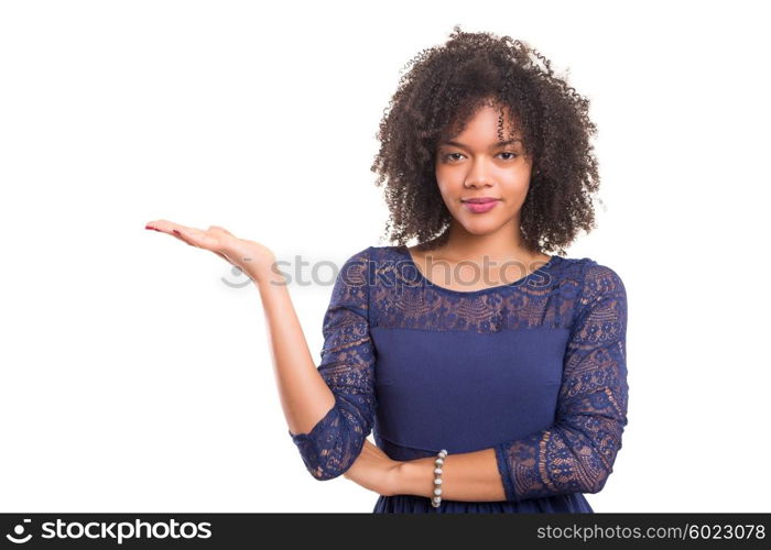 Young beautiful african woman presenting your product, isolated over white background