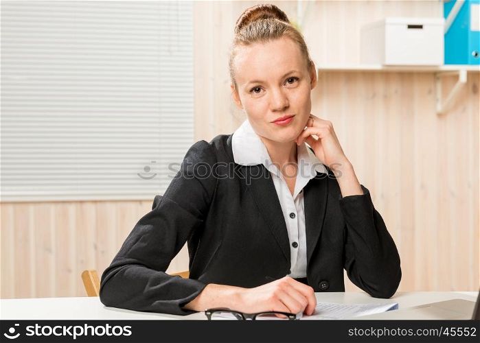 young beautiful and very successful woman at work in office