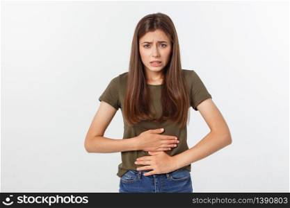 Young beautiful asian woman having painful stomachache on white background. Young beautiful asian woman having painful stomachache on white background.