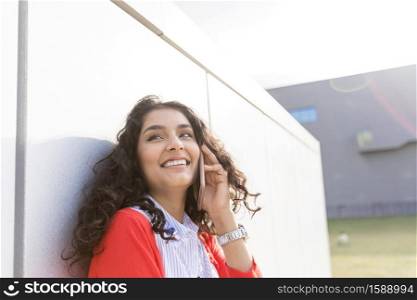 Young beautiful autumn woman with cell phone