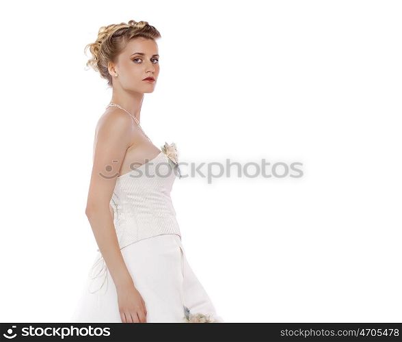 Young beautiful blond girl with a wedding hairstyle. Portrait of the bride on a white background isolated