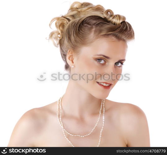 Young beautiful blond girl with a wedding hairstyle. Portrait of the bride on a white background isolated