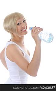 Young beautiful blonde drinking water from a bottle. Isolated on white background