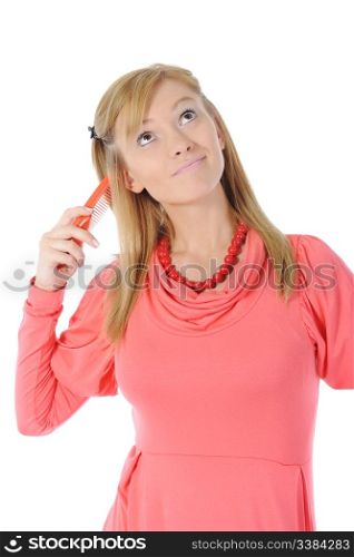 Young beautiful blonde with a hairbrush in his hand. Isolated on white background