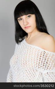 young beautiful brunette in a white blouse