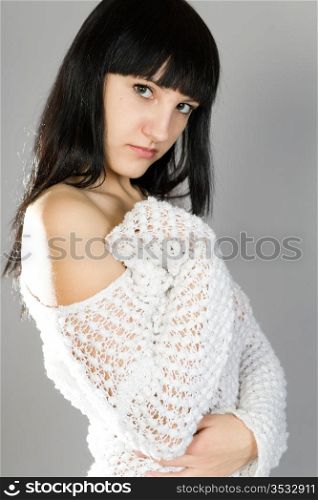 young beautiful brunette in a white blouse
