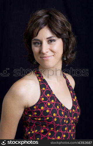 young beautiful brunette portrait against black background