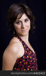 young beautiful brunette portrait against black background