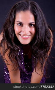 young beautiful brunette portrait against black background