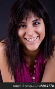 young beautiful brunette portrait against black background