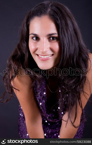 young beautiful brunette portrait against black background