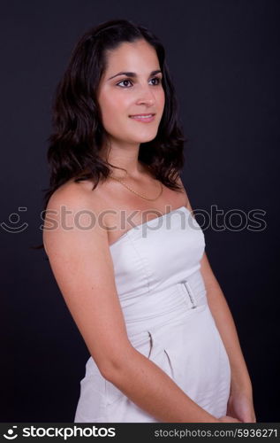 young beautiful brunette portrait against black background