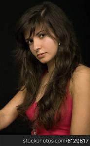 young beautiful brunette portrait against black background