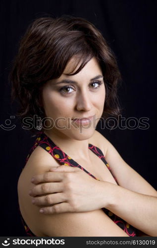 young beautiful brunette portrait against black background