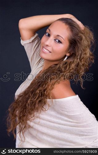 young beautiful brunette portrait against dark background