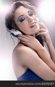 Young beautiful brunette wearing headphones
