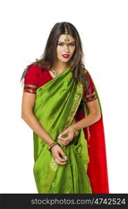 Young beautiful brunette woman in indian green dress