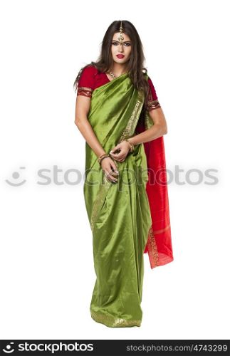 Young beautiful brunette woman in indian green dress