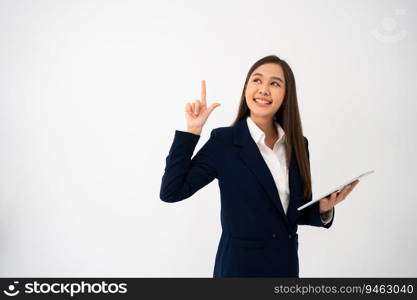 Young beautiful business woman pointing up at copyspace and looking at on pointing over isolated background cheerful with smile on face. Concept of advertising marketing and product placement concept