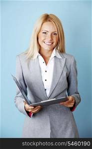 Young beautiful business woman with folder