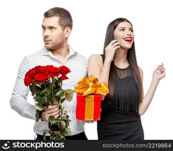 Young beautiful caucasian couple with present isolated on white. Young beautiful couple with present isolated on white