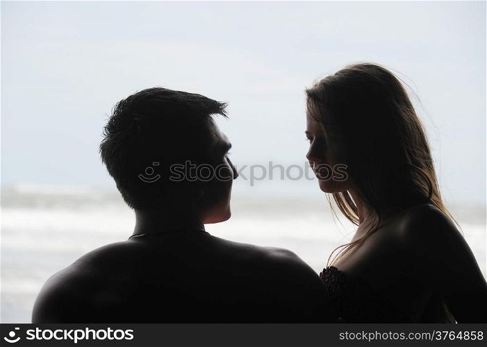 Young beautiful couple on a sunny beach