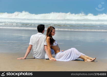 Young beautiful couple on a sunny beach