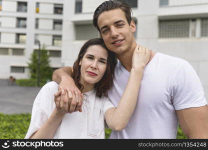 Young beautiful couple posing wearing jeans and t-shirt