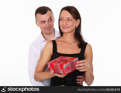 young beautiful couple together with a present